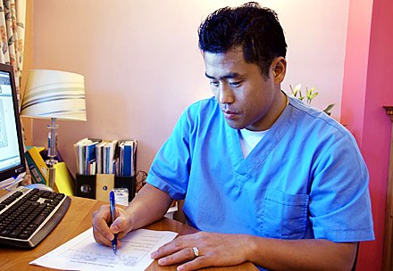 Taegyun Kim reviewing patient notes
